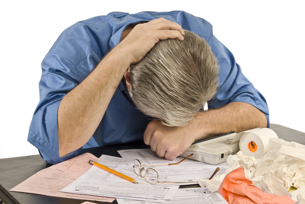 Horizontal Shot Of Man With Tax Troubles -Tax Time Troubles